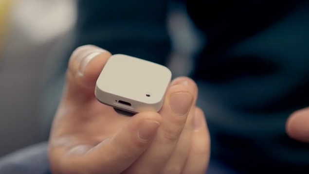 The Memoto Camera held in a hand